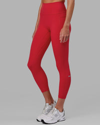 Woman wearing Fusion Ultra High-Rise 7/8 Legging Pockets - Scarlet | Model:Elise | Size:S