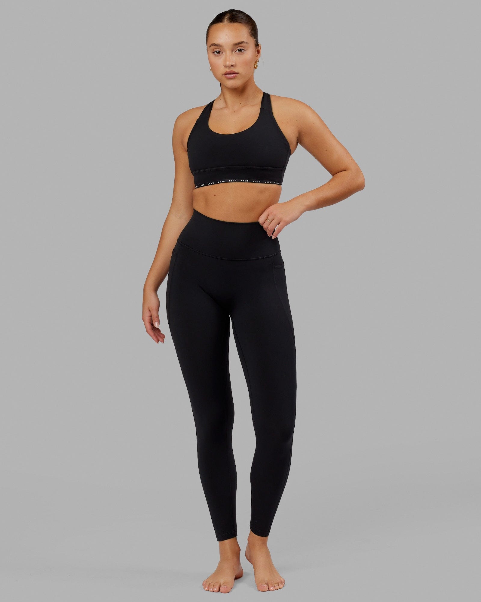 Woman wearing O.G. Fusion Ultra High-Rise Full Length Legging Pockets - Black | Model:Milly | Size:S