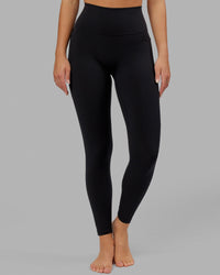 Woman wearing O.G. Fusion Ultra High-Rise Full Length Legging Pockets - Black | Model:Krystal | Size:L