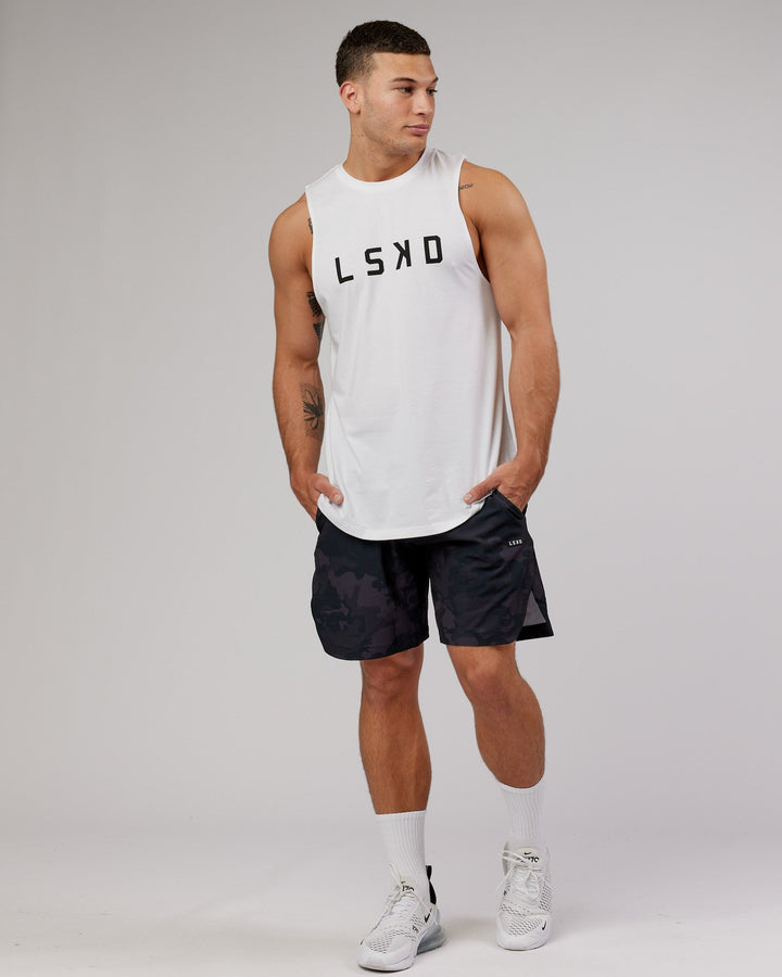 Man wearing Competition 8" Performance Short - Black Camo