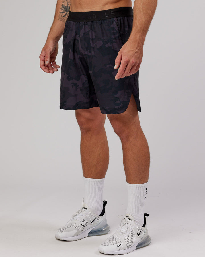Man wearing Competition 8" Performance Short - Black Camo