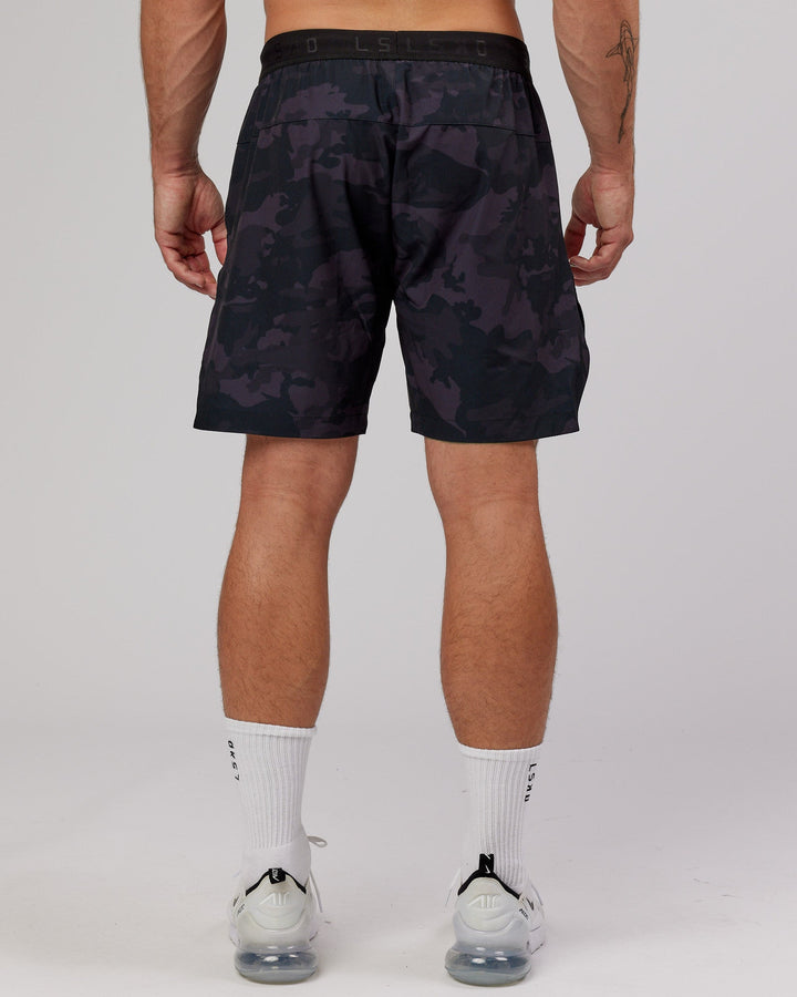 Man wearing Competition 8" Performance Short - Black Camo