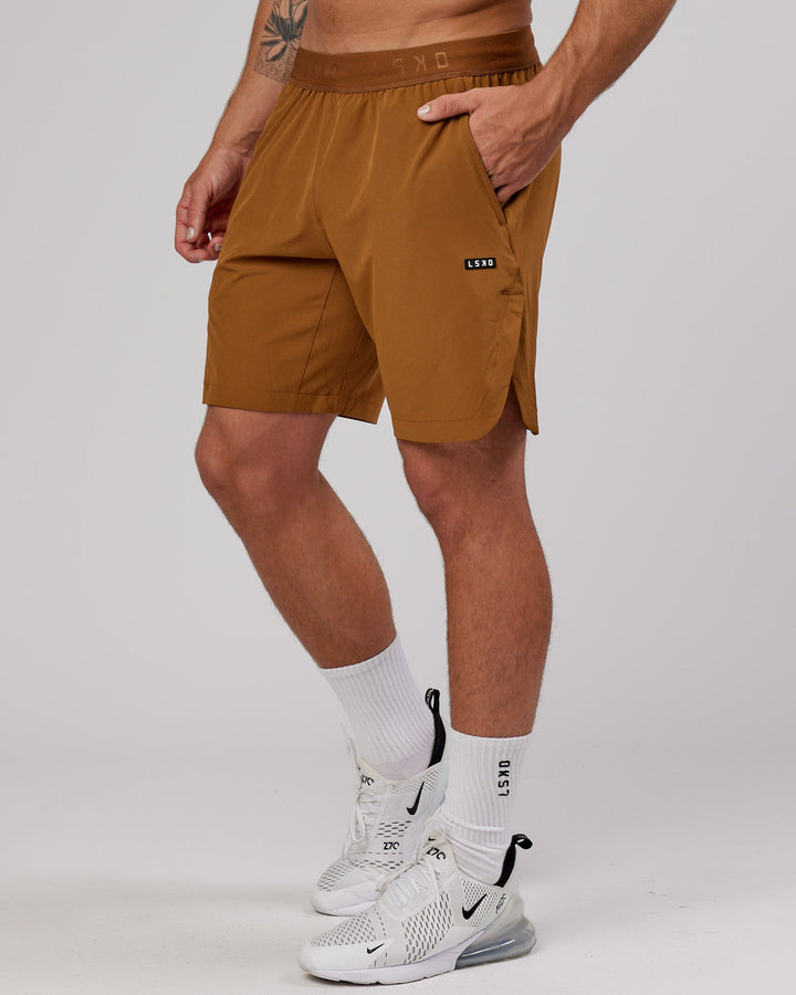 Man wearing Competition 8" Performance Short - Camel
