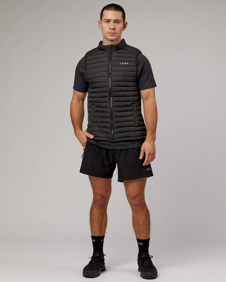 Man wearing Uplift Puffer Vest - Black Fade