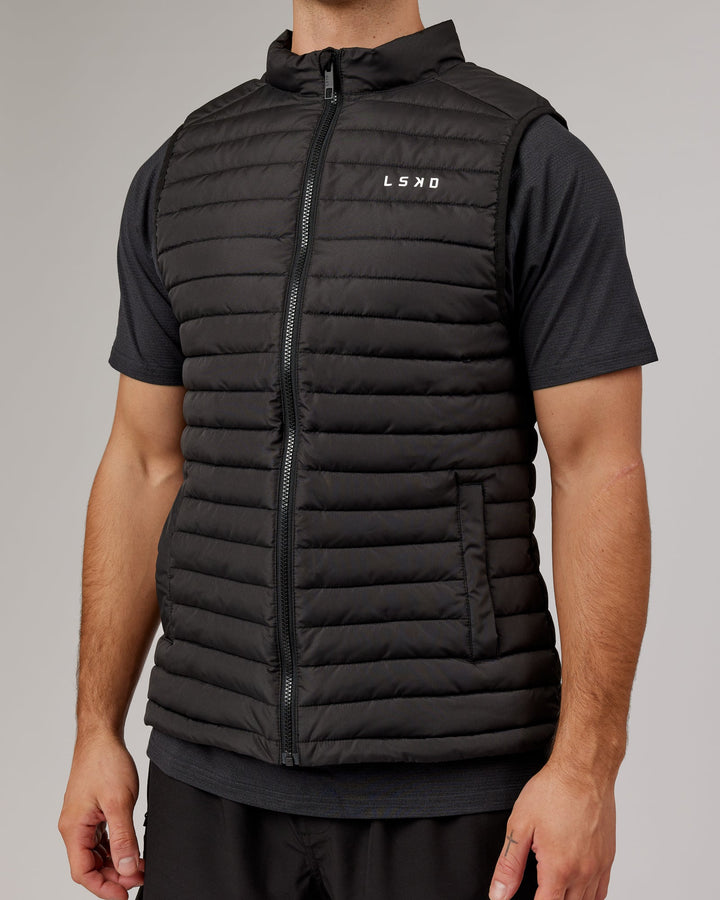 Man wearing Uplift Puffer Vest - Black Fade